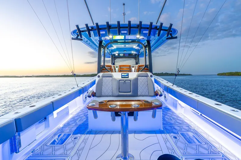 Slide: The Image of Luxurious 2025 Freeman 43 boat interior with modern design and ambient lighting on open water. - 26