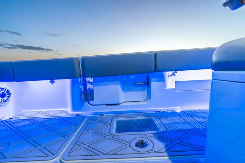 Slide: The Image of Interior of 2025 Freeman 43 boat with blue LED lighting at sunset. - 29