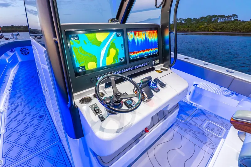 Slide: The Image of 2025 Freeman 43 boat cockpit with advanced navigation system and illuminated deck. - 34