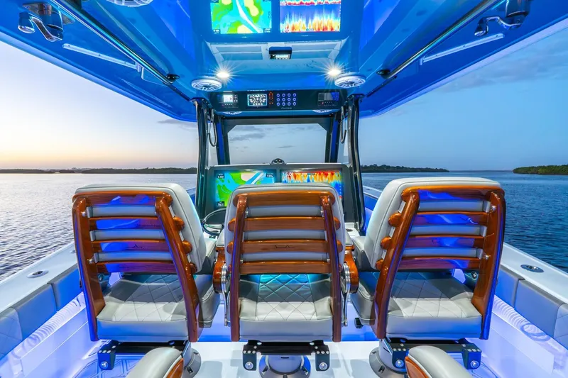 Slide: The Image of Interior of 2025 Freeman 43 boat with illuminated dashboard and luxurious seating. - 36