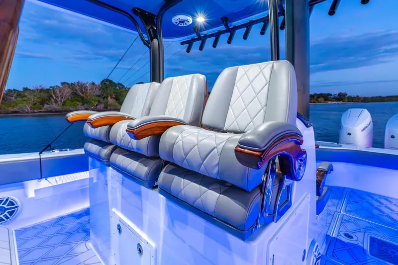 Slide: The Image of Luxurious seating on a 2025 Freeman 43 boat, featuring elegant design and ambient lighting. - 39