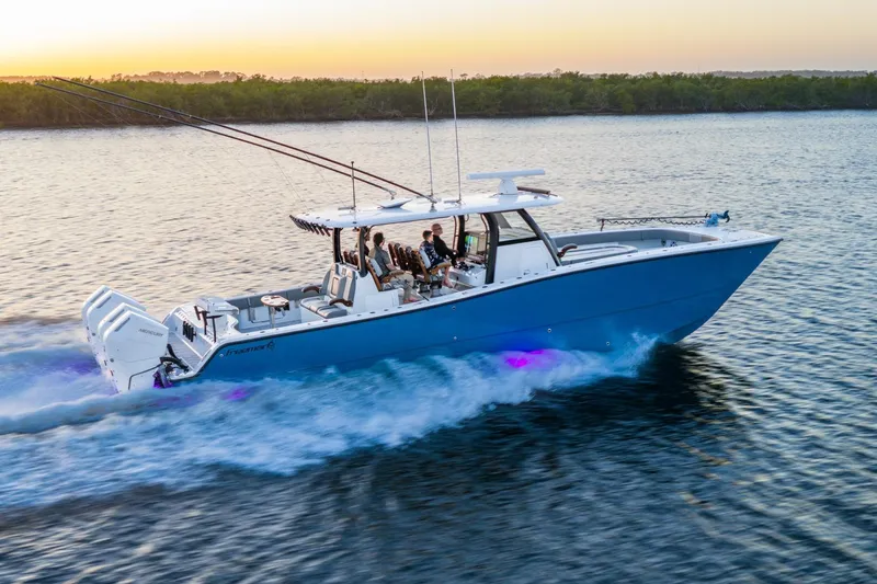 Slide: The Image of Aerial view of 2025 Freeman 43 boat with glowing red underwater lights. - 4