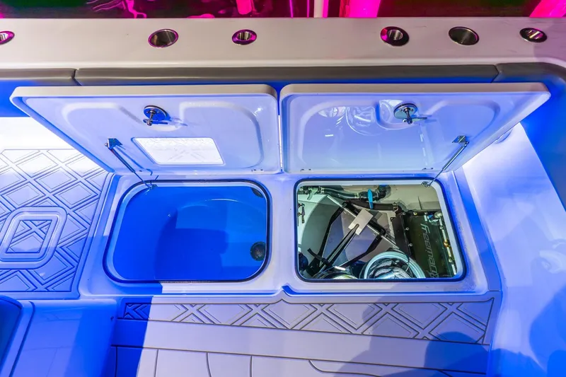 Slide: The Image of 2025 Freeman 43 boat storage compartments with blue lighting and modern design. - 44