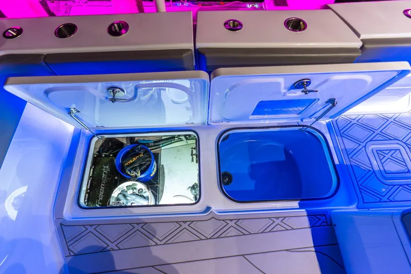 Slide: The Image of 2025 Freeman 43 boat interior with open storage compartments and modern lighting. - 45
