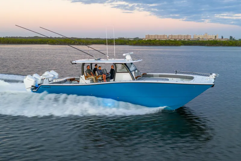 Slide: The Image of Modern Freeman 43 boat cruising on water, 2025 model, with powerful engines and sleek design. - 7