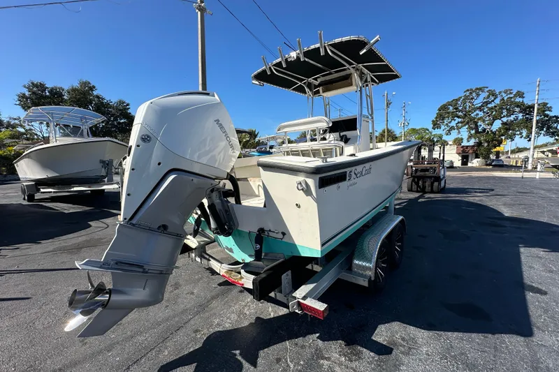 Slide: The Image of 1977 SeaCraft 23 CC boat with Mercury outboard motor on trailer. - 4