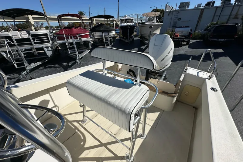 Slide: The Image of 1977 SeaCraft 23 CC boat interior with seating and Mercury outboard motor. - 9