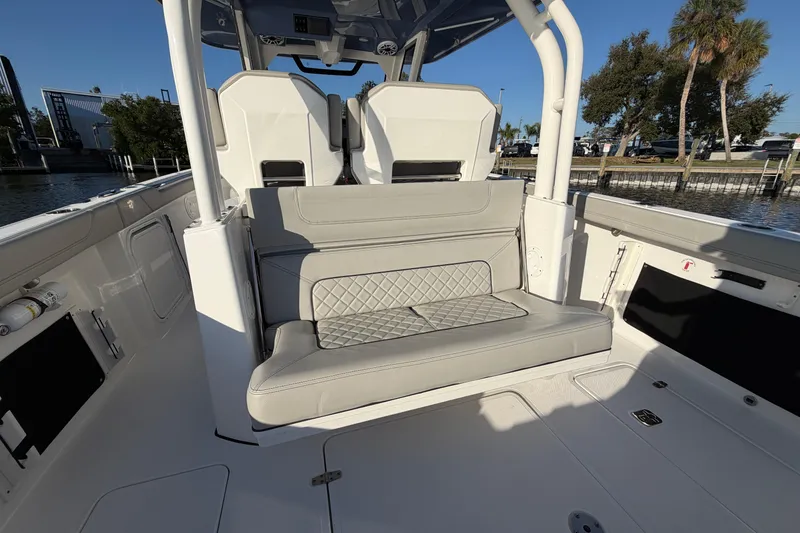 Slide: The Image of 2023 Pursuit S 328 Sport boat interior with cushioned seating and modern design. - 23