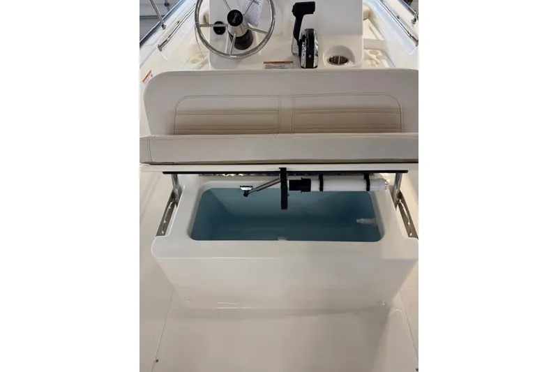 Slide: The Image of 2026 Boston Whaler 170 Montauk boat interior with seating and storage compartment. - 14
