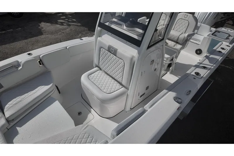 Slide: The Image of 2026 Sea Fox 248 Commander boat interior with cushioned seating and console. - 10