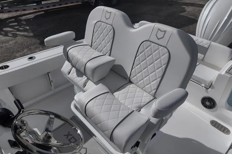 Slide: The Image of Luxurious seating on 2026 Sea Fox 248 Commander boat with quilted upholstery and armrests. - 13