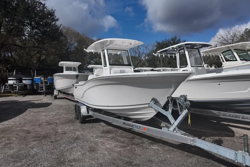 Slide: The Image of 2026 Sea Fox 248 Commander boat on trailer under cloudy sky. - 3