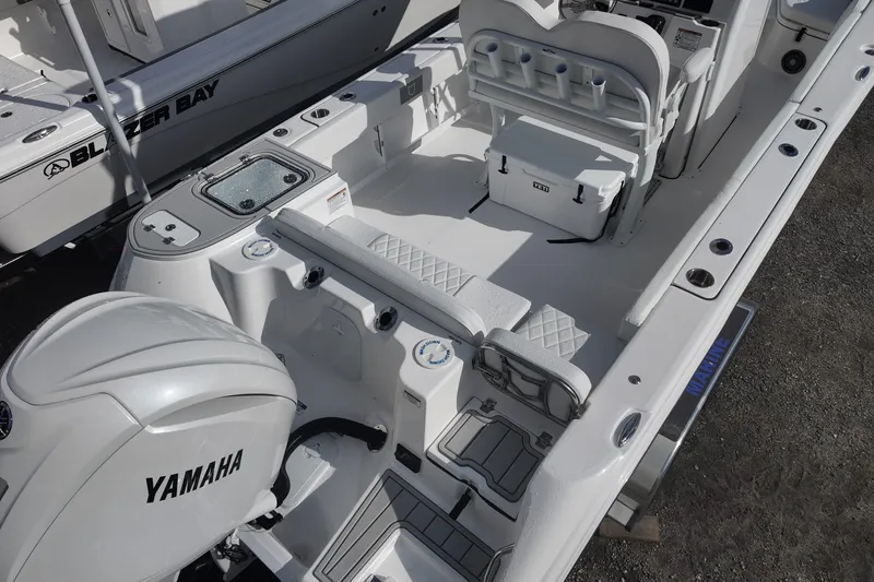 Slide: The Image of 2026 Sea Fox 248 Commander boat interior with Yamaha engine, featuring seating and storage. - 5