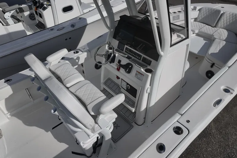 Slide: The Image of 2026 Sea Fox 248 Commander boat interior with helm and seating area. - 6
