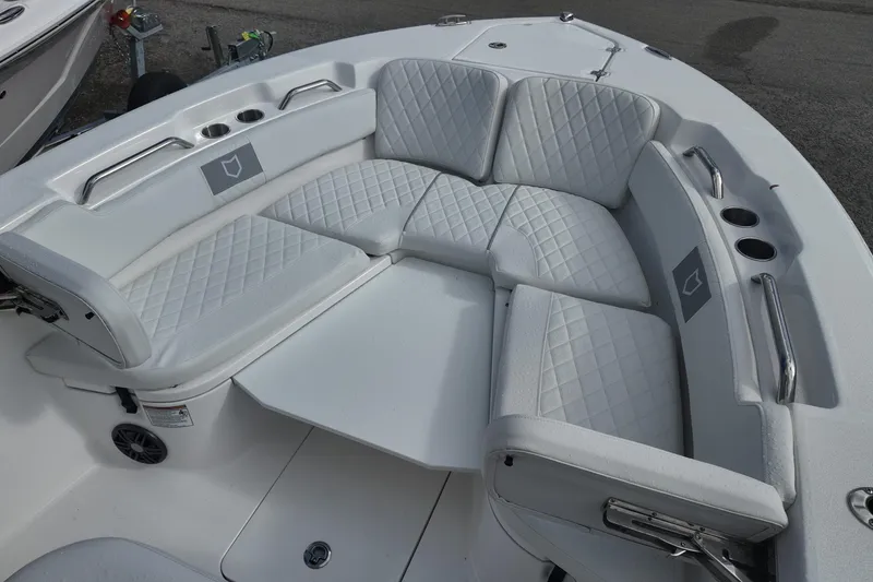 Slide: The Image of 2026 Sea Fox 248 Commander boat with white cushioned seating and cup holders. - 8