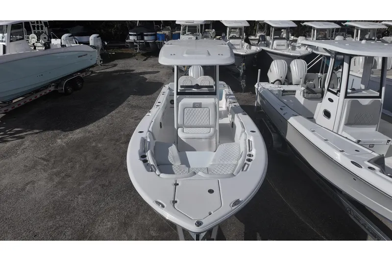 Slide: The Image of 2026 Sea Fox 248 Commander boat displayed in a marina, surrounded by other vessels. - 9