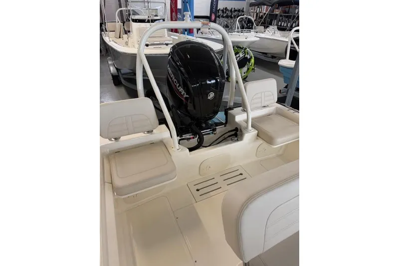 Slide: The Image of 2026 Boston Whaler 170 Montauk boat interior with Mercury engine. - 11