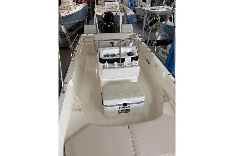 Slide: The Image of 2026 Boston Whaler 170 Montauk boat interior with seating and console. - 8