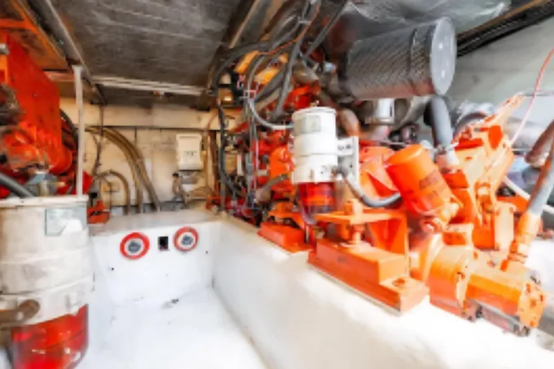 Slide: The Image of Engine room of 1988 Ocean Yachts 48 Super Sport with visible machinery and components. - 38