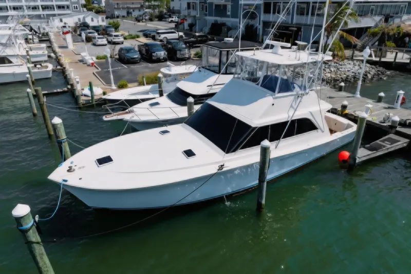 Slide: The Image of 1988 Ocean Yachts 48 Super Sport docked at marina, aerial view. - 5