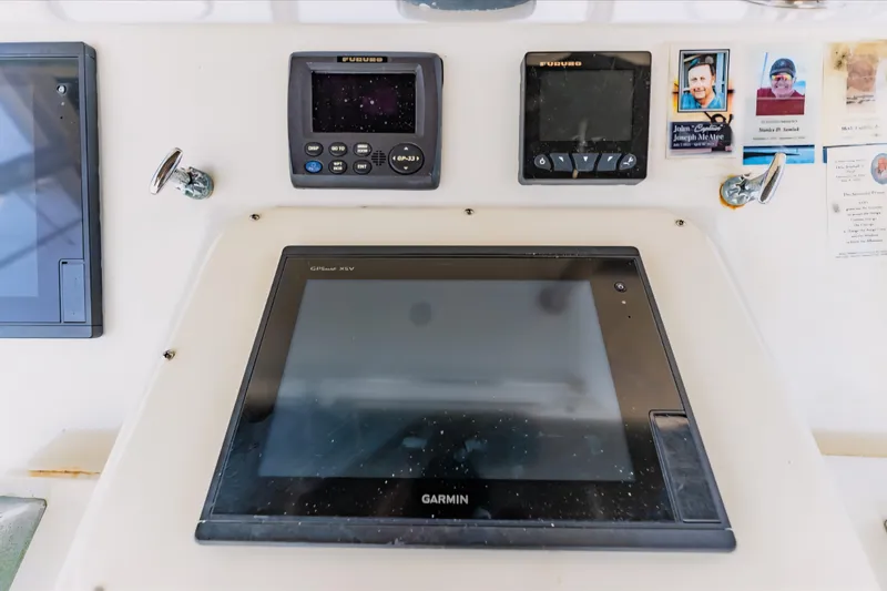 Slide: The Image of Control panel of 1988 Ocean Yachts 48 Super Sport with Garmin and Furuno displays. - 9