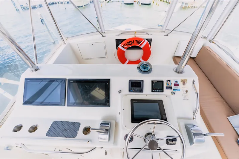 Slide: The Image of Cockpit of 1988 Ocean Yachts 48 Super Sport with navigation equipment and steering wheel. - 10