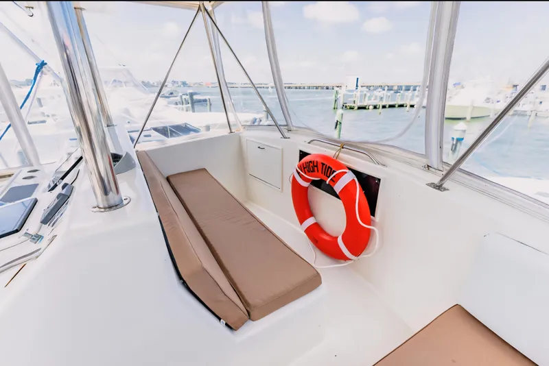 Slide: The Image of 1988 Ocean Yachts 48 Super Sport interior with seating and life preserver. - 16
