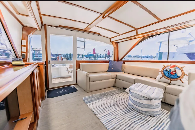 Slide: The Image of Luxurious interior of 1988 Ocean Yachts 48 Super Sport with plush seating and nautical decor. - 19