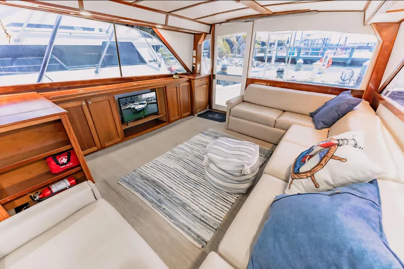 Slide: The Image of Luxurious interior of 1988 Ocean Yachts 48 Super Sport with cozy seating and nautical decor. - 21