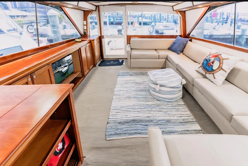 Slide: The Image of Luxurious interior of 1988 Ocean Yachts 48 Super Sport with plush seating and nautical decor. - 24