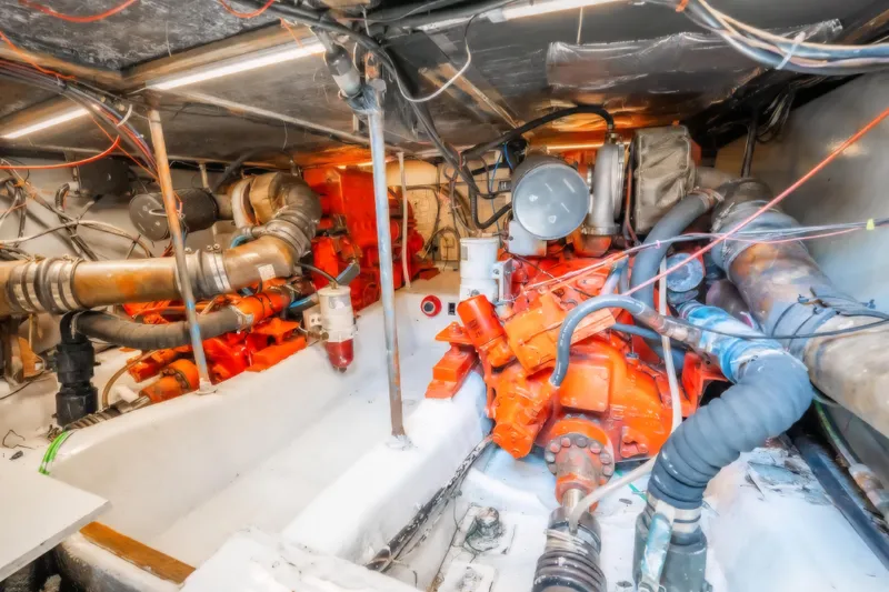Slide: The Image of Engine room of 1988 Ocean Yachts 48 Super Sport with visible machinery and wiring. - 35