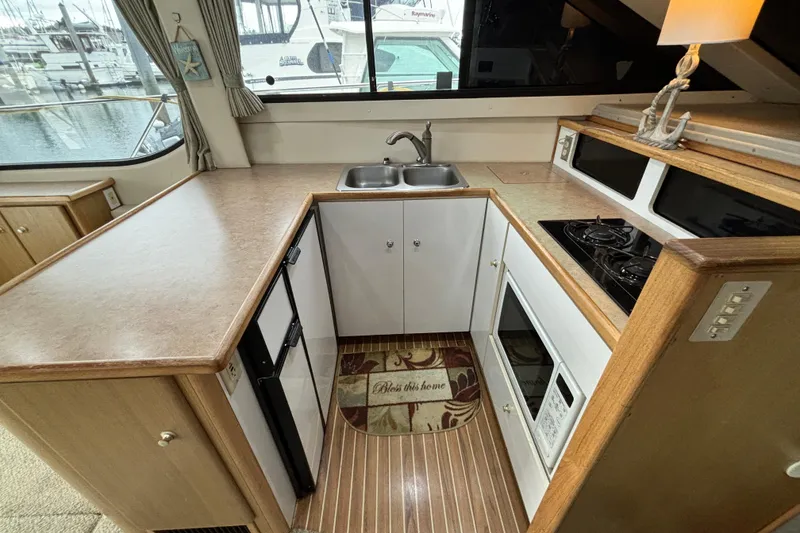 Slide: The Image of Interior helm of 2000 Bayliner 3788 Command Bridge Motoryacht with steering wheel and gauges. - 11