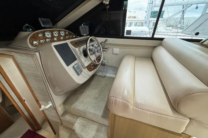 Slide: The Image of Bathroom in 2000 Bayliner 3788 Command Bridge Motoryacht with wooden door and compact design. - 12