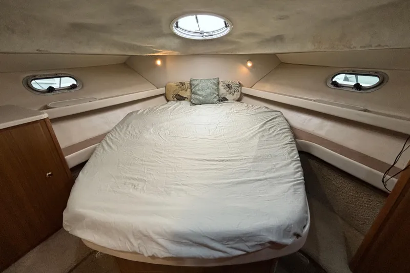 Slide: The Image of Interior cabin of 2000 Bayliner 3788 Command Bridge Motoryacht with beige quilted bedding. - 14