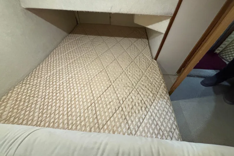 Slide: The Image of 2000 Bayliner 3788 Command Bridge Motoryacht interior with two seats and life jackets. - 15