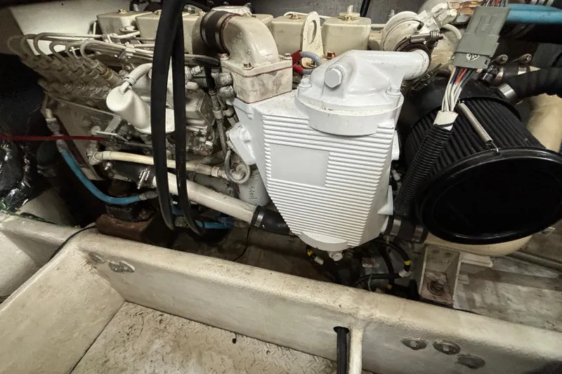 Slide: The Image of Engine compartment of a 2000 Bayliner 3788 Command Bridge Motoryacht with red components. - 18