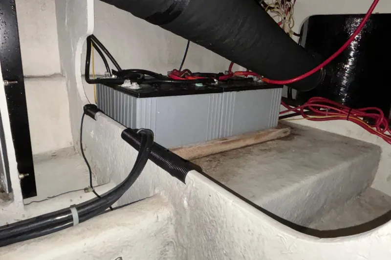 Slide: The Image of Engine compartment of a 2000 Bayliner 3788 Command Bridge Motoryacht, showcasing mechanical components. - 21