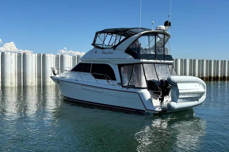 Slide: The Image of 2000 Bayliner 3788 Command Bridge Motoryacht interior with stairs and sliding door. - 3