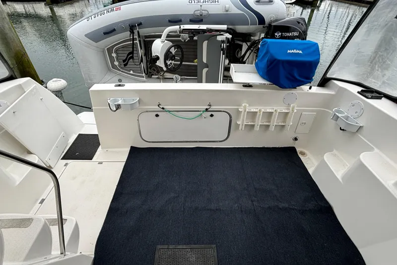 Slide: The Image of Bayliner 3788 Command Bridge Motoryacht with inflatable dinghy and Tohatsu outboard motor. - 5