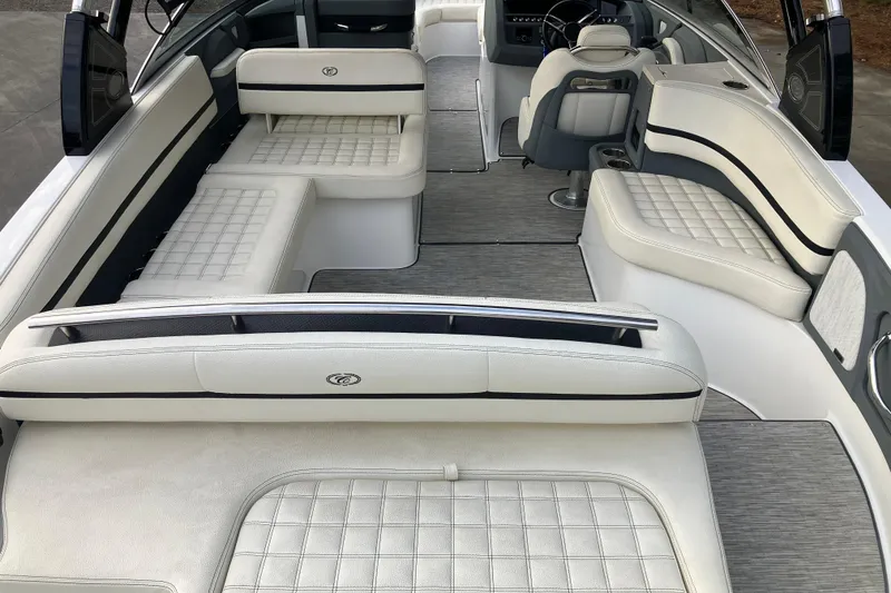 Slide: The Image of 2021 Cobalt R7 Surf boat interior with luxurious white seating and modern design. - 11
