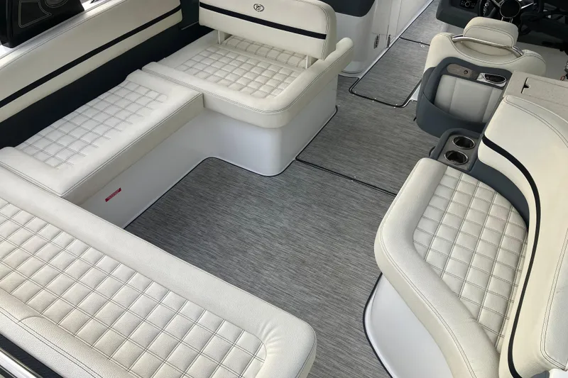 Slide: The Image of 2021 Cobalt R7 Surf boat interior with white quilted seating and modern design. - 15