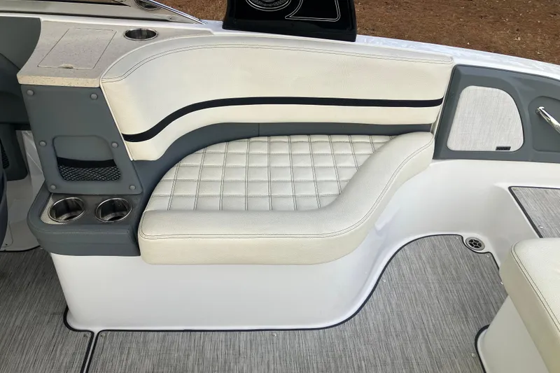 Slide: The Image of 2021 Cobalt R7 Surf boat interior with cushioned seating and cup holders. - 16