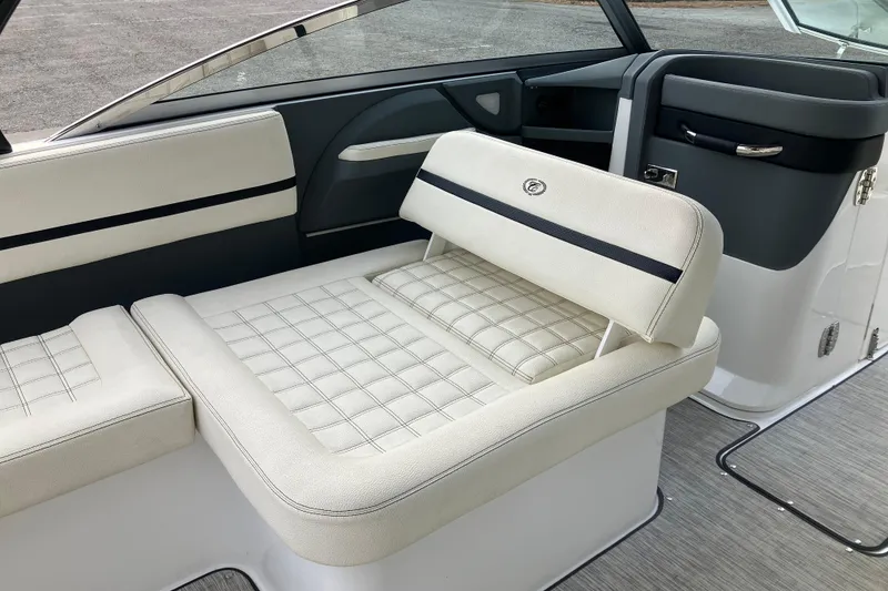 Slide: The Image of 2021 Cobalt R7 Surf boat interior with white cushioned seating and sleek design. - 17