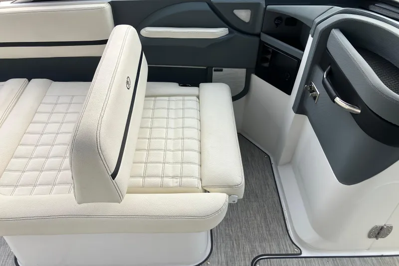 Slide: The Image of 2021 Cobalt R7 Surf boat interior with white cushioned seating and modern design. - 19