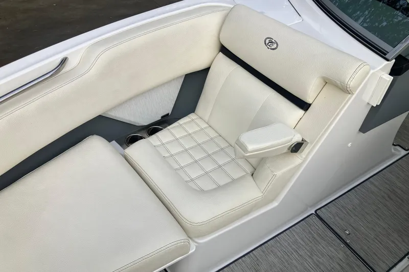 Slide: The Image of 2021 Cobalt R7 Surf boat interior with white cushioned seating and armrest. - 27