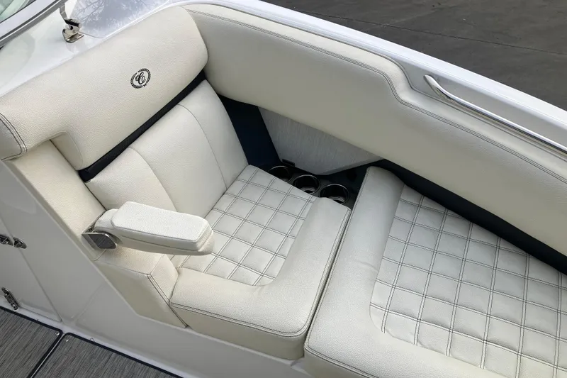 Slide: The Image of 2021 Cobalt R7 Surf boat interior with white cushioned seating. - 28