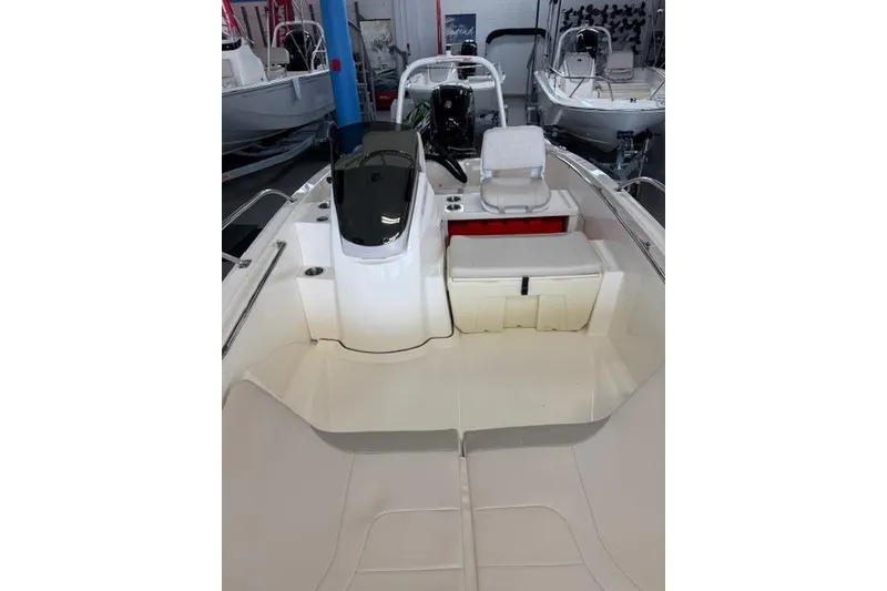 Slide: The Image of 2026 Boston Whaler 160 Super Sport interior view, showcasing seating and console. - 7