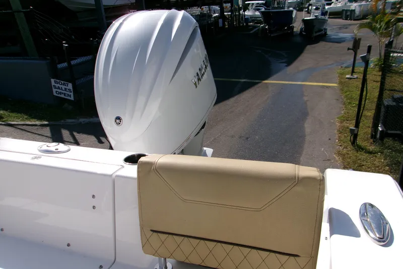 Slide: The Image of 2025 Sportsman Heritage 231 Center Console boat with Yamaha outboard engine at sales dock. - 13