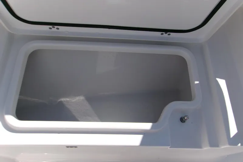 Slide: The Image of Open storage compartment in 2025 Sportsman Heritage 231 Center Console boat. - 17