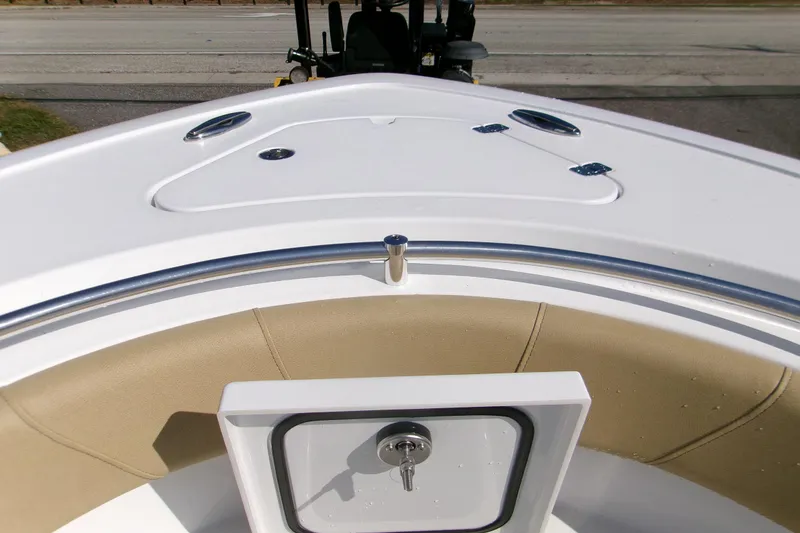 Slide: The Image of 2025 Sportsman Heritage 231 Center Console boat interior with cushioned seating and storage. - 18